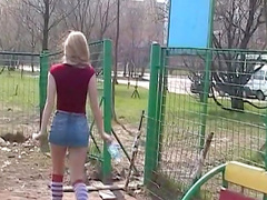 Blonde is fucking her tight puss outdoors