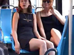 Fun gals kiss on bus
